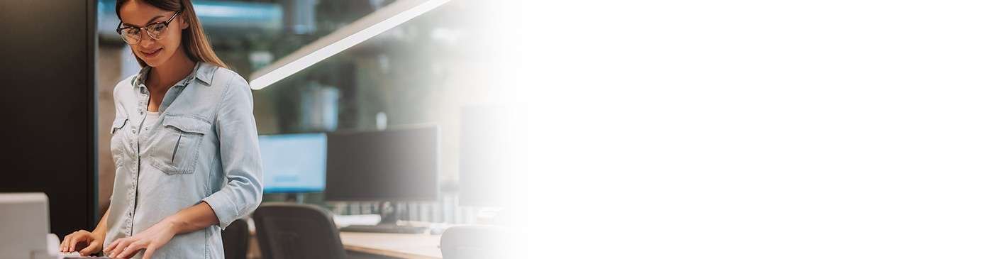 Woman standing at copy machine